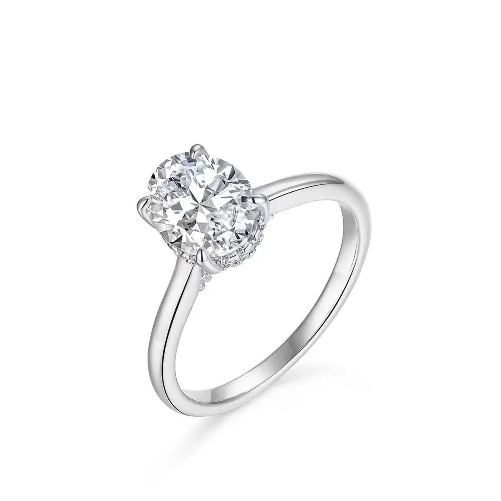 Juno oval moissanite ring detail of four-prong setting